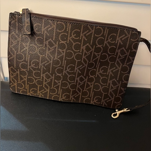 Calvin Klein Handbags - Calvin Klein Brown Monogram Pouch